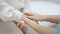 Hand of female doctor comforting patient at consulting room Royalty Free Stock Photo