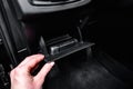 Hand female open glove compartment box inside car. Royalty Free Stock Photo