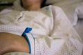 A hand of female patient with hospital bracelet while hospitalized and recovery. Close up Royalty Free Stock Photo