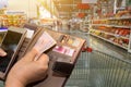 Hand of female picking credit cards and money from her wallet for shopping Royalty Free Stock Photo