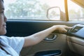 Hand of female turning on car air conditioning system,Button on dashboard in car panel Royalty Free Stock Photo