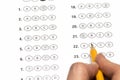 Hand fill in Exam papers sheet and pencil Royalty Free Stock Photo