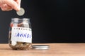 Hand fill a money coin into the bottle Royalty Free Stock Photo