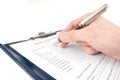 Hand filling in medical questionnaire form Royalty Free Stock Photo