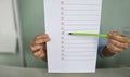 Hand filling yes and no at the checklist box. Closeup. survey and poll Royalty Free Stock Photo