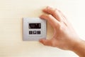 Hand with finger on air conditioner switch control Royalty Free Stock Photo