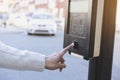 Hand finger pressing or pushing on stop request button at crosswalk, Traffic light at square in urban or city Royalty Free Stock Photo