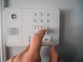 Hand and finger is pushing or pressing the alarm code Royalty Free Stock Photo