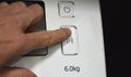 hand finger on the start panel of the washing machine Royalty Free Stock Photo