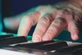 Hand and fingers of pianist or keyboardist of a rock band close up playing a synthesizer or piano Royalty Free Stock Photo