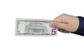 Hand with five dollar bill, isolated on white background. Royalty Free Stock Photo