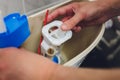 Hand is fixing a toilet cistern at home. Royalty Free Stock Photo