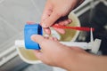 Hand is fixing a toilet cistern at home. Royalty Free Stock Photo