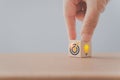 hand flip lightbulb to dartboard icon on wooden cube block, including copy space for change ideas to target, improvement,