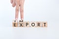 Hand flip wooden cube with word IMPORT to EXPORT. import and export business commercial trade logistic container cargo freight