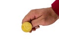 Hand flipping cryptocurrency golden coin