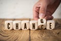 Hand flipping one of six cubes, turning the word `change ` to `chance ` Royalty Free Stock Photo