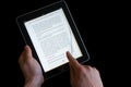 Hand flipping page on an ipad screen Royalty Free Stock Photo