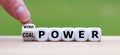 Hand flips a dice and changes the expression `coal power` to `wind power` Royalty Free Stock Photo