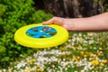 Hand with flying disc Royalty Free Stock Photo