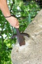 sword stuck in the rock as in the mythological story of King Arthur