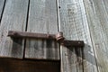 Hand forged door hinges on an old barn