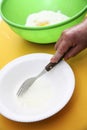Hand with fork whiiping eggwhites in white small Royalty Free Stock Photo