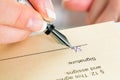 Hand with fountain pen signing contract Royalty Free Stock Photo