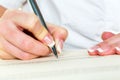 Hand with fountain pen signing contract Royalty Free Stock Photo