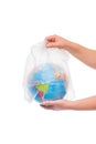 hand freeing the earth from a plastic bag, the concept of pollution Royalty Free Stock Photo