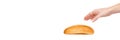 Hand with fresh bun isolated on white background Royalty Free Stock Photo