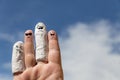 Hand in front of blue sky, injured finger Royalty Free Stock Photo