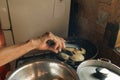 Hand frying venezuelan pasteles in a kitchen Royalty Free Stock Photo
