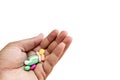 Hand full of different pills on white  background with copy space Royalty Free Stock Photo