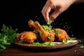 hand garnishing fresh fried chicken with parsley sprigs
