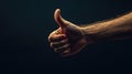 Hand Gesture of Thumbs Up in Soft Focus with Dramatic Lighting Royalty Free Stock Photo