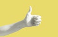 Hand gesture on yellow background poster. Thumb up. Like social web