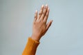 Hand Gestures: Exploring the Nonverbal Communication of Raised Open Palm, a Universal Symbol of Stop, Peace, or Surrender, Often