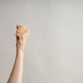 Hand gestures. Hand gestures. woman& x27;s fist stretches up, a symbol of the struggle for rights and dissent, Royalty Free Stock Photo