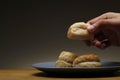 Hand getting a freshly baked Filipino-Chinese sweet bread