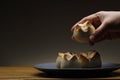 Hand getting a freshly baked Filipino sweet bread