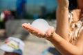 On the hand of the girl a bubble of dry ice, nitrogen. Nitrogen scientific experiments and show, shows for people and