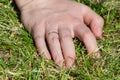 Hand on the girl on the grass Royalty Free Stock Photo