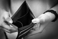 Hand of girl holding a wallet,hand open an empty wallet,no cash,financial problem,economic depression,effects of the Covid-19,