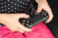 Hand girl playing Sony Dualshock 4 Royalty Free Stock Photo