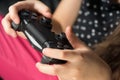 Hand girl playing Sony Dualshock 4 Royalty Free Stock Photo