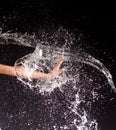 Hand girl resists flow, water jet