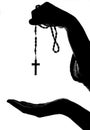 Hand gives rosary