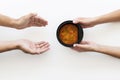 Hand giving bowl soup needy person. High quality and resolution beautiful photo concept Royalty Free Stock Photo