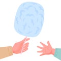 Hand giving the cotton candy to child hand. Hand with blue candy floss with on white background.